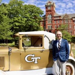 Image of Peter Graening with the Ramblin' Reck in front of Tech Tower